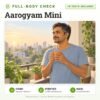 Aarogyam Mini: 78 tests included, full-body health check package with home sample collection. Illustration: a man enjoying a morning cup of tea on his balcony.